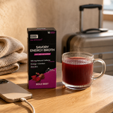GOBBi Bold Beet Energy Broth and a warm cup in a hotel room