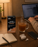 GOBBi Mighty Mushroom Energy Broth and a warm cup at a home desk